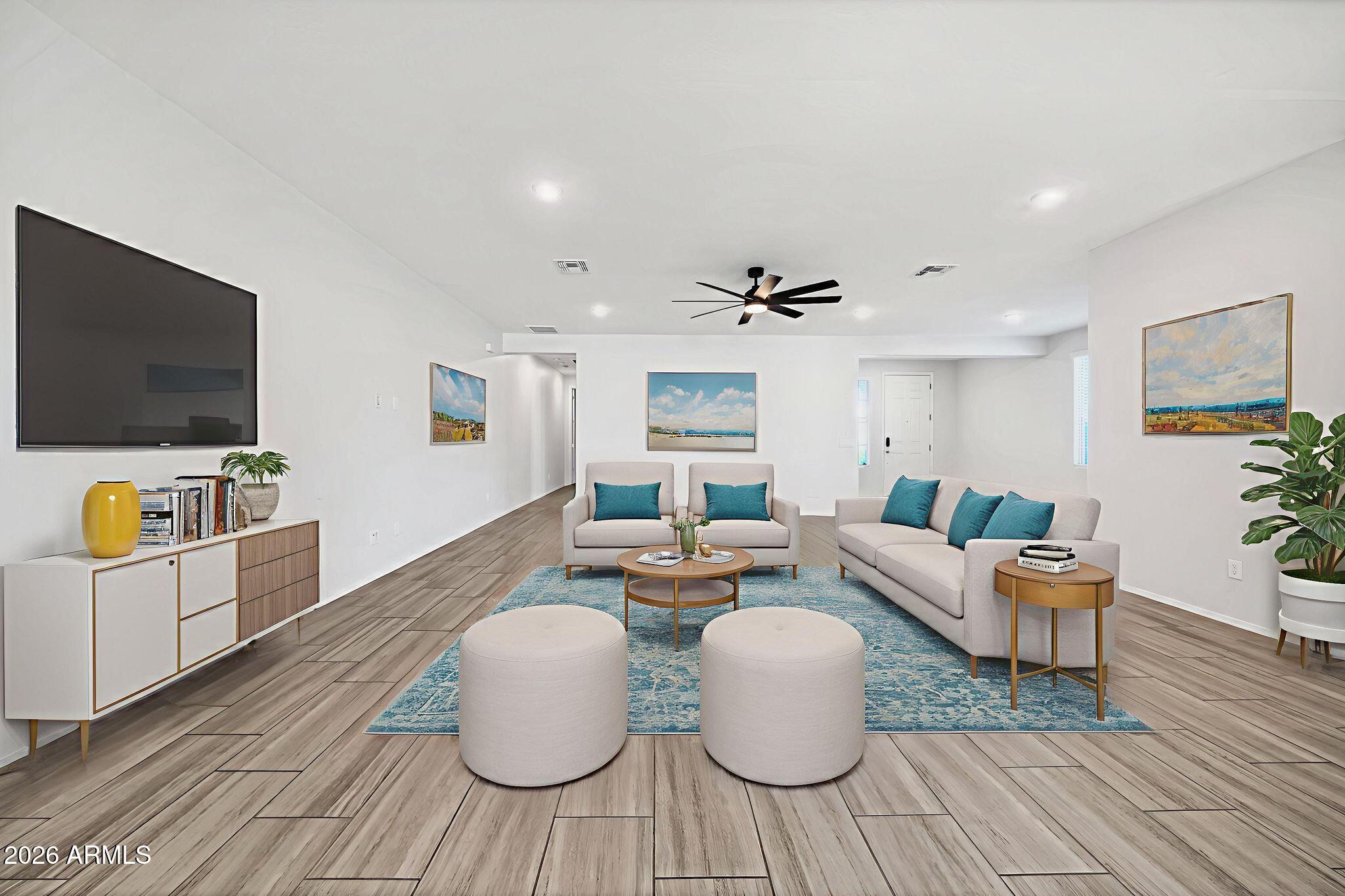 14384 West Hearn Road Surprise, AZ 85379 - Photo 23 of 63 a living room with furniture and a flat screen tv