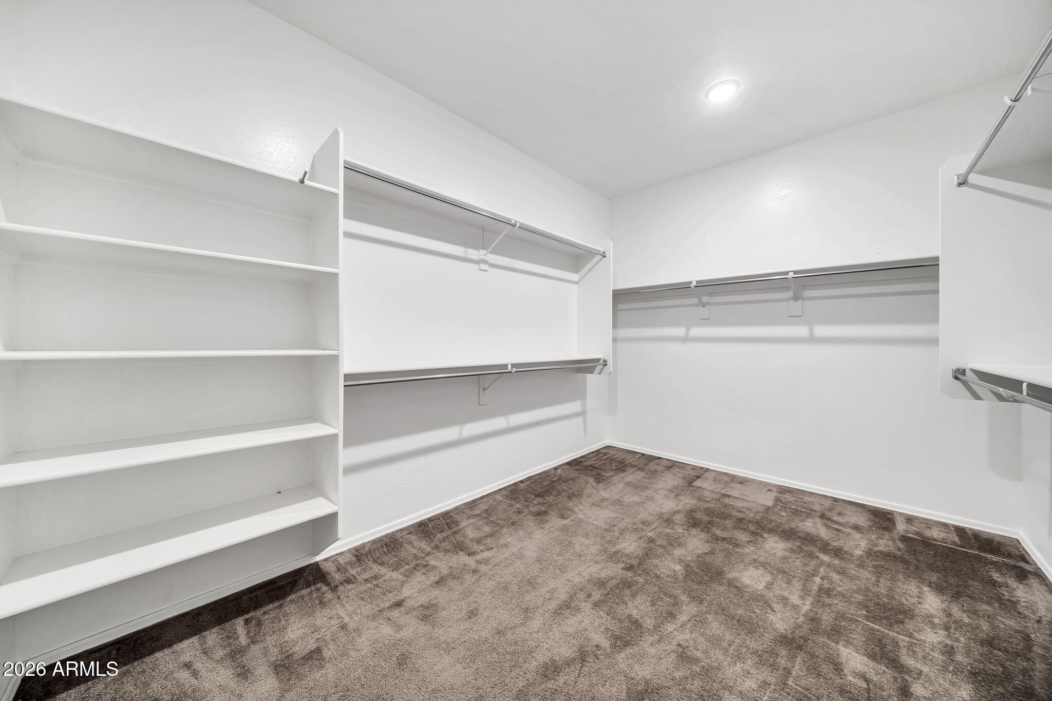 14384 West Hearn Road Surprise, AZ 85379 - Photo 30 of 63 a view of a room with shelf on the wall