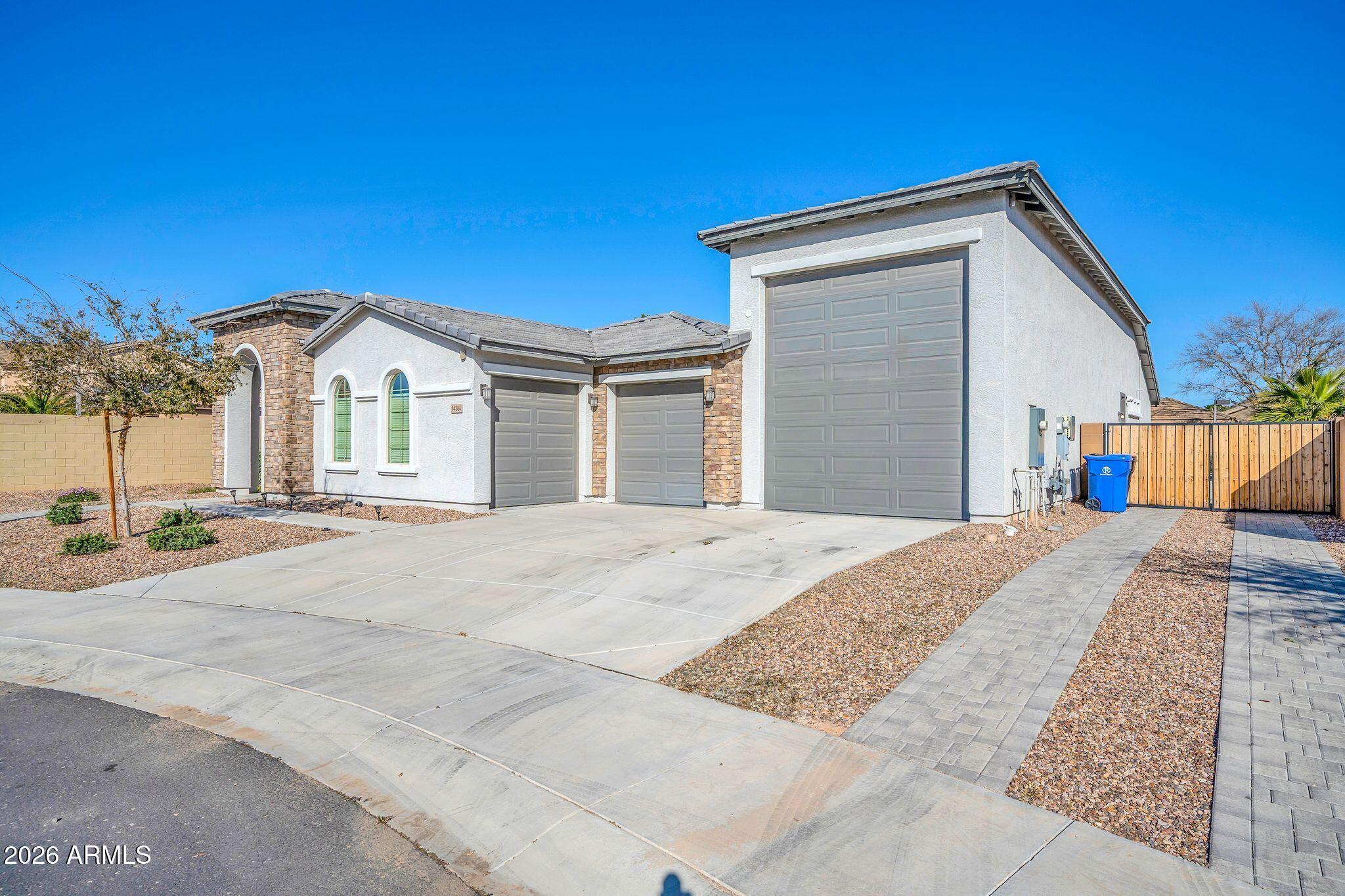 14384 West Hearn Road Surprise, AZ 85379 - Photo 3 of 63 a front view of a house with a yard