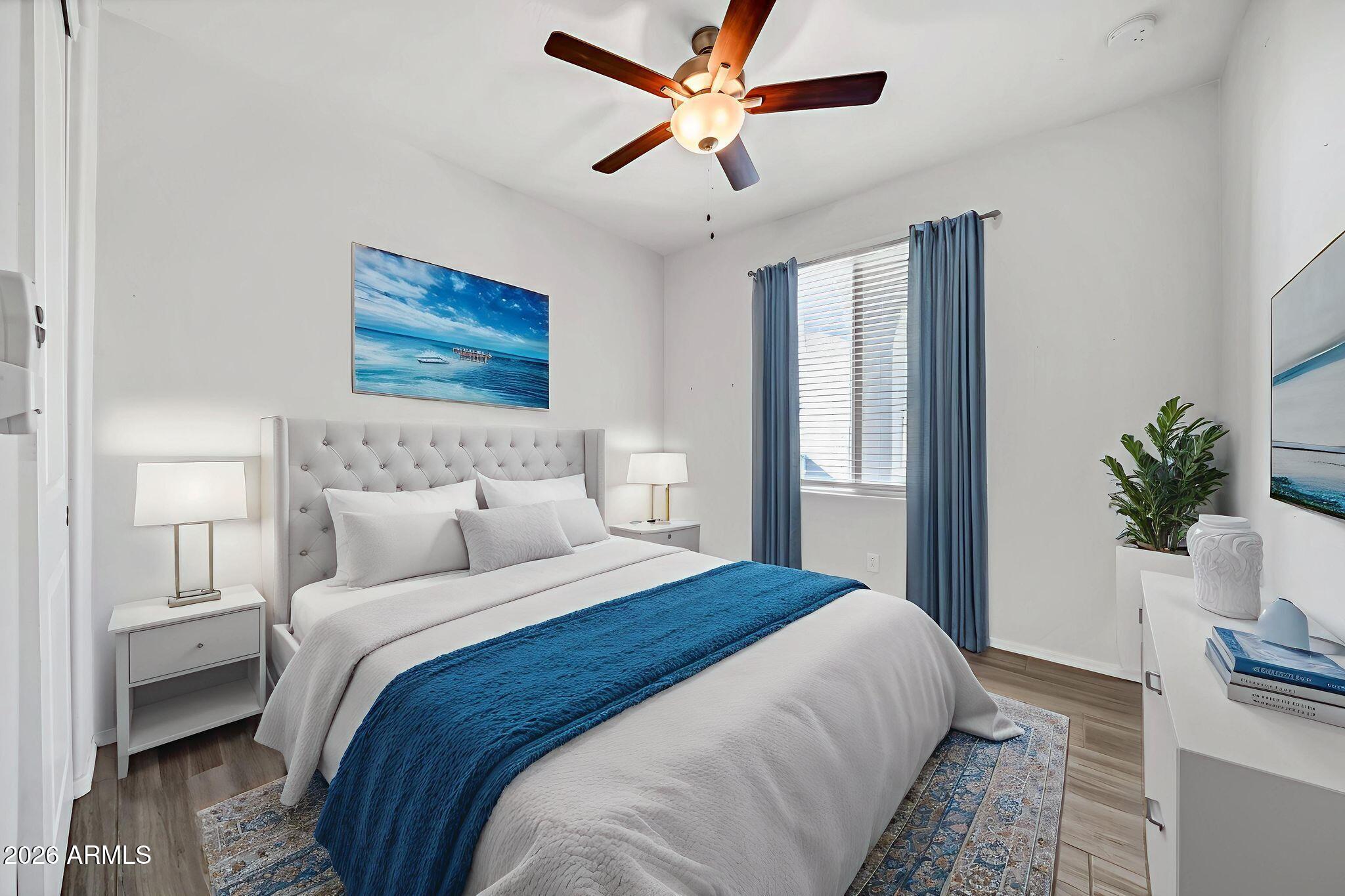 14384 West Hearn Road Surprise, AZ 85379 - Photo 34 of 63 a bedroom with bed and a window