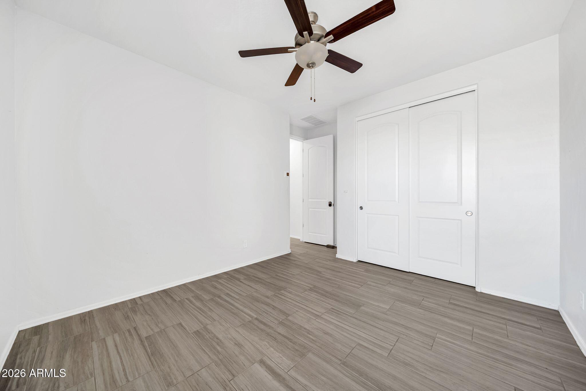 14384 West Hearn Road Surprise, AZ 85379 - Photo 35 of 63 wooden floor in an empty room