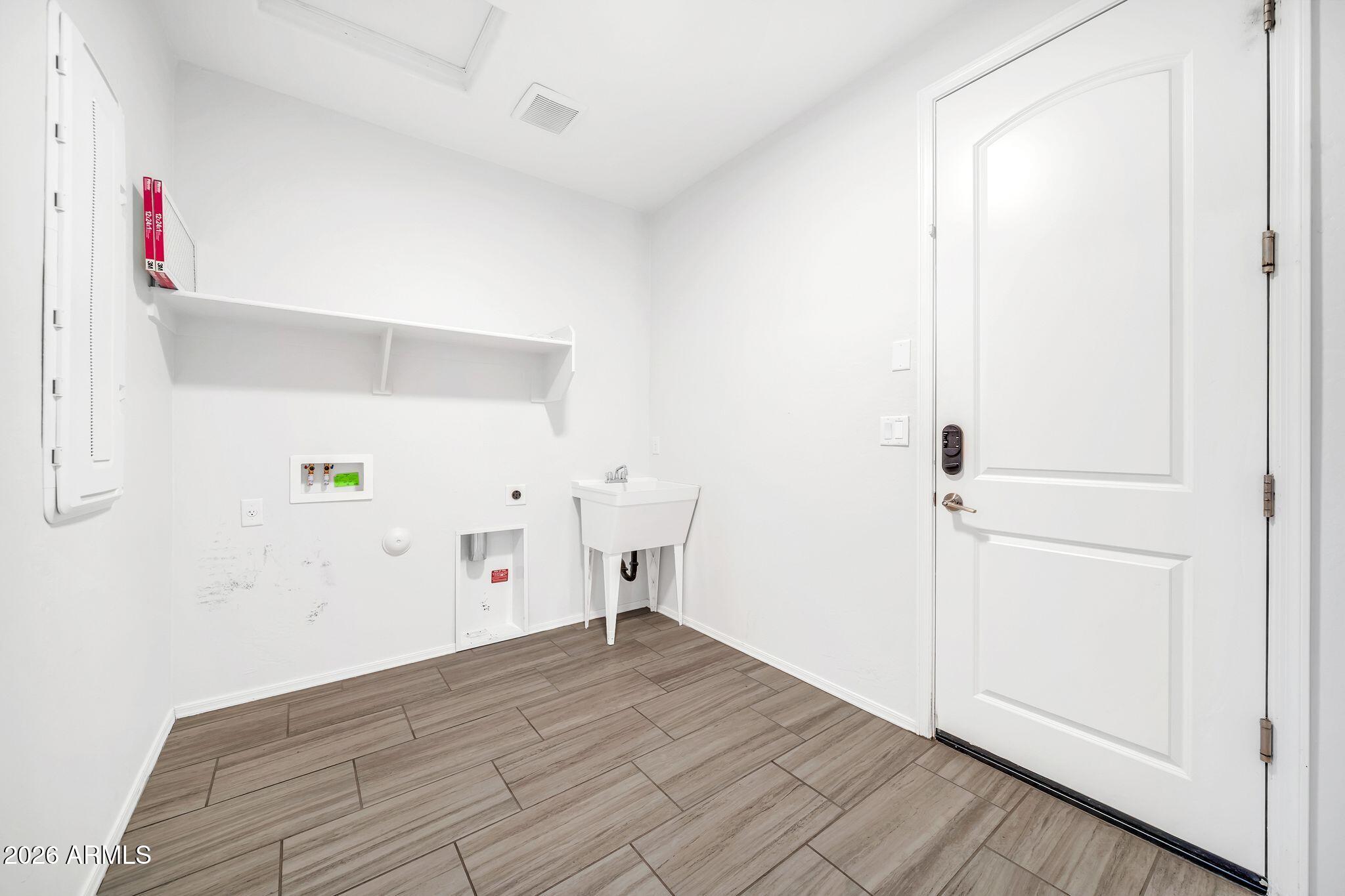 14384 West Hearn Road Surprise, AZ 85379 - Photo 38 of 63 a view of empty room with wooden floor