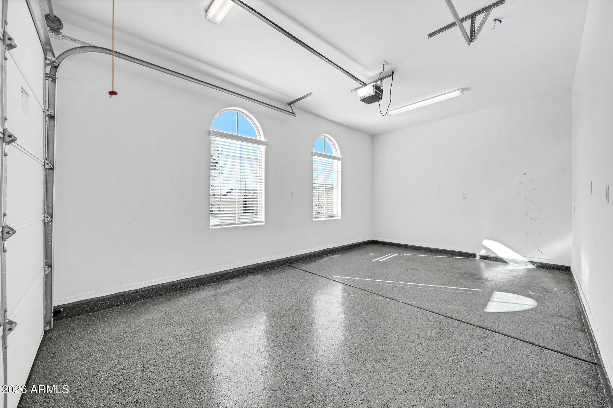 14384 West Hearn Road Surprise, AZ 85379 - Photo 41 of 63 an empty room with windows and ceiling fan