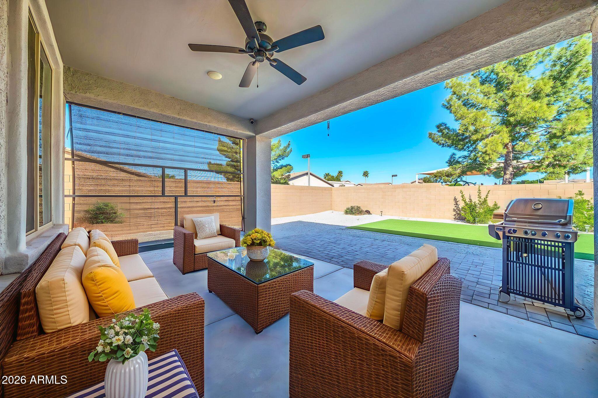14384 West Hearn Road Surprise, AZ 85379 - Photo 45 of 63 a outdoor living space with furniture and garden