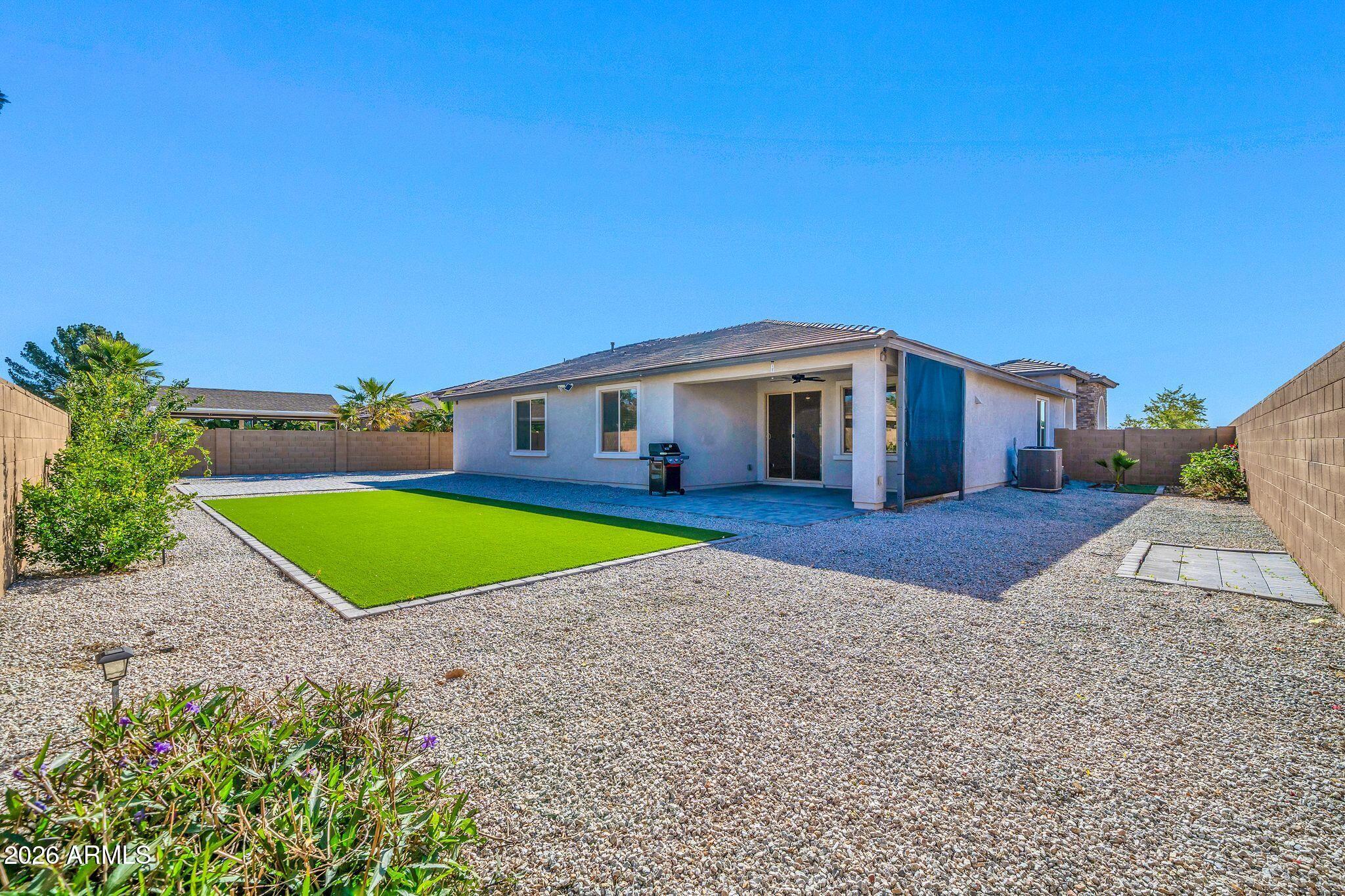 14384 West Hearn Road Surprise, AZ 85379 - Photo 48 of 63 a view of house with swimming pool outdoor seating