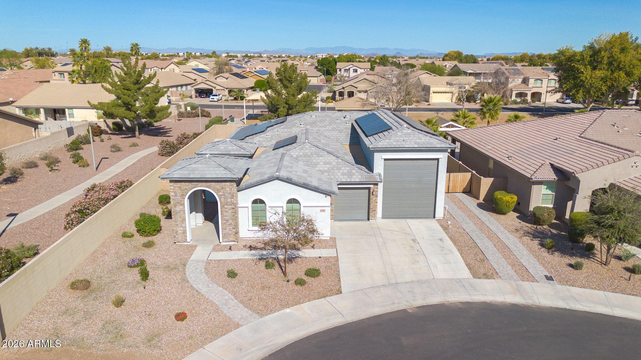 14384 West Hearn Road Surprise, AZ 85379 - Photo 53 of 63 an aerial view of multiple houses with a yard