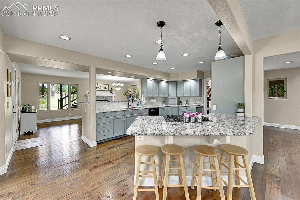 17350 Goshawk Road Colorado Springs, CO 80908 - Photo 12 of 50 a view of a kitchen and dining room