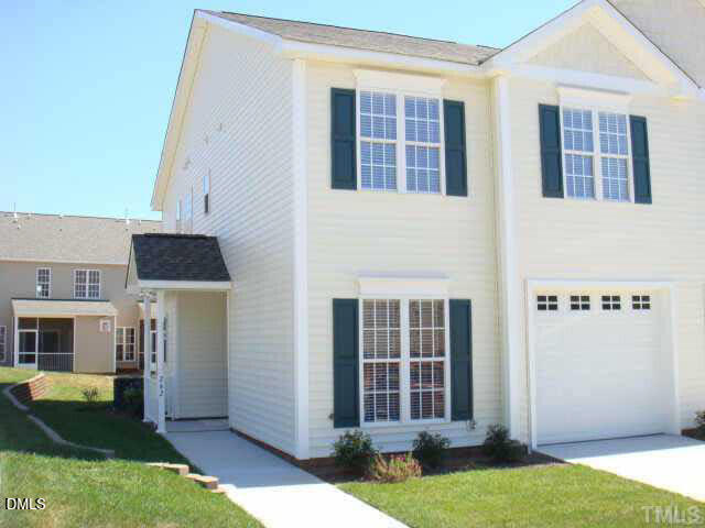 242 Sugar Maple Avenue Wake Forest, NC 27587 - Photo 1 of 7 a front view of a house with a yard