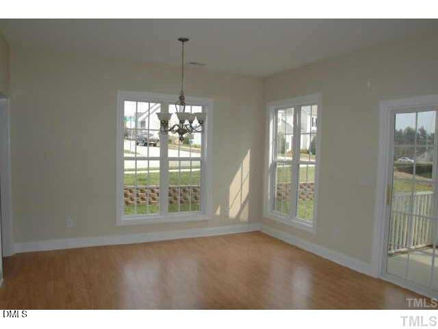 242 Sugar Maple Avenue Wake Forest, NC 27587 - Photo 4 of 7 a view of an empty room with a window