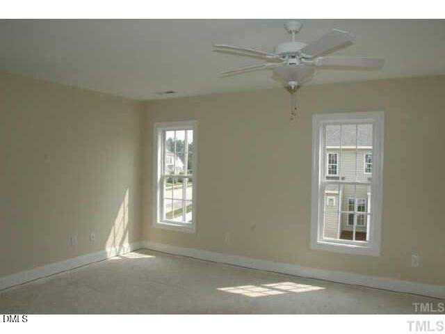 242 Sugar Maple Avenue Wake Forest, NC 27587 - Photo 5 of 7 a view of an empty room with a window