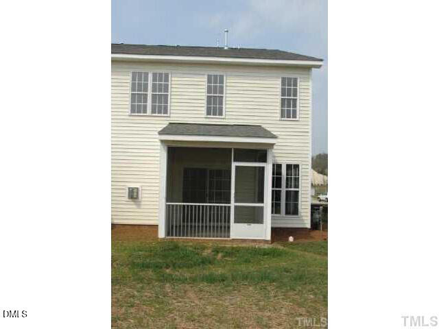 242 Sugar Maple Avenue Wake Forest, NC 27587 - Photo 7 of 7 a view of a house with a large window and a yard