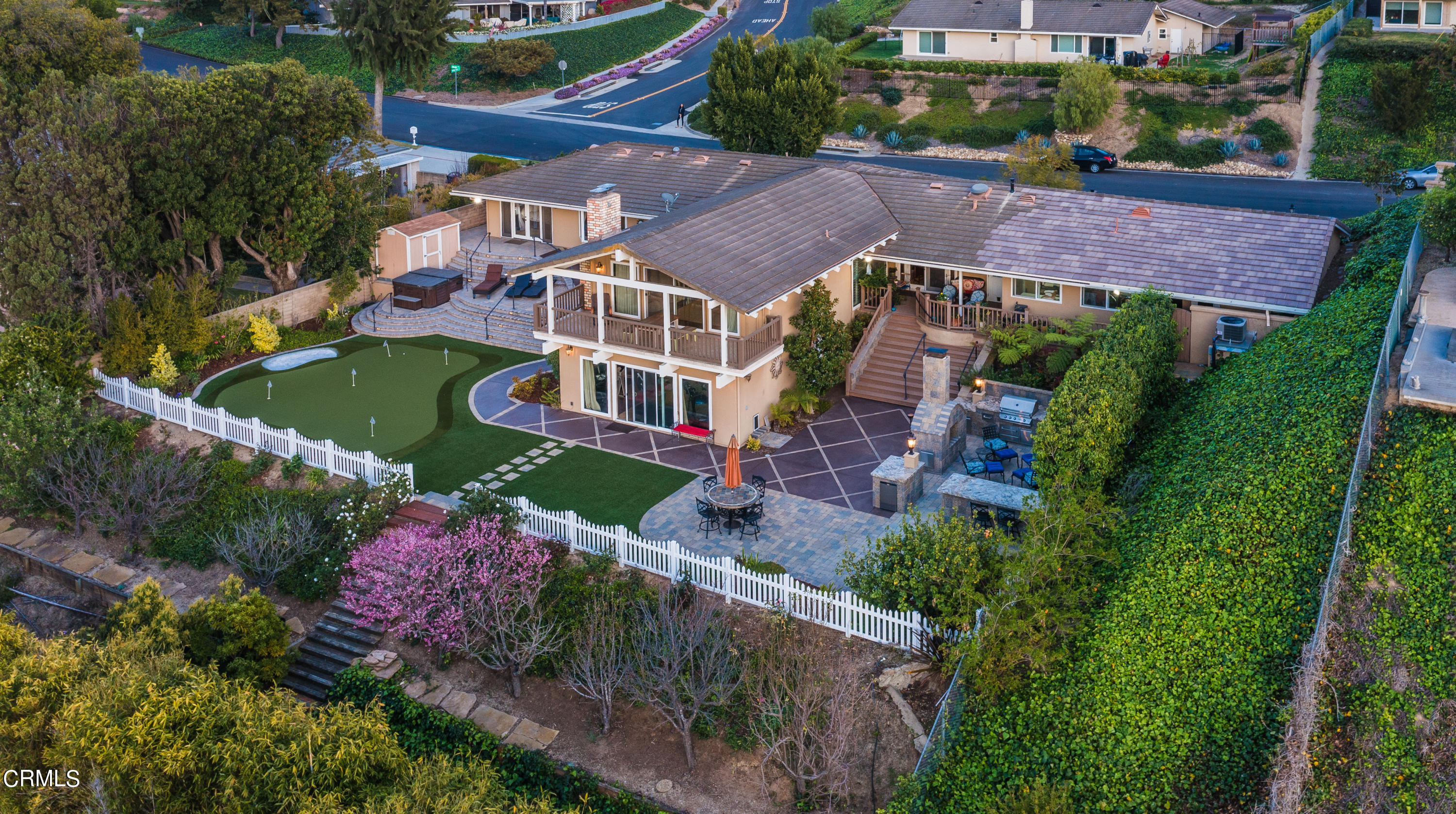 an aerial view of house with swimming pool outdoor seating and yard