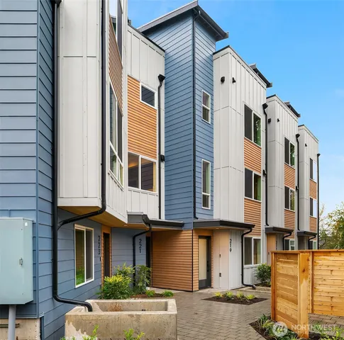 a front view of a building with a yard