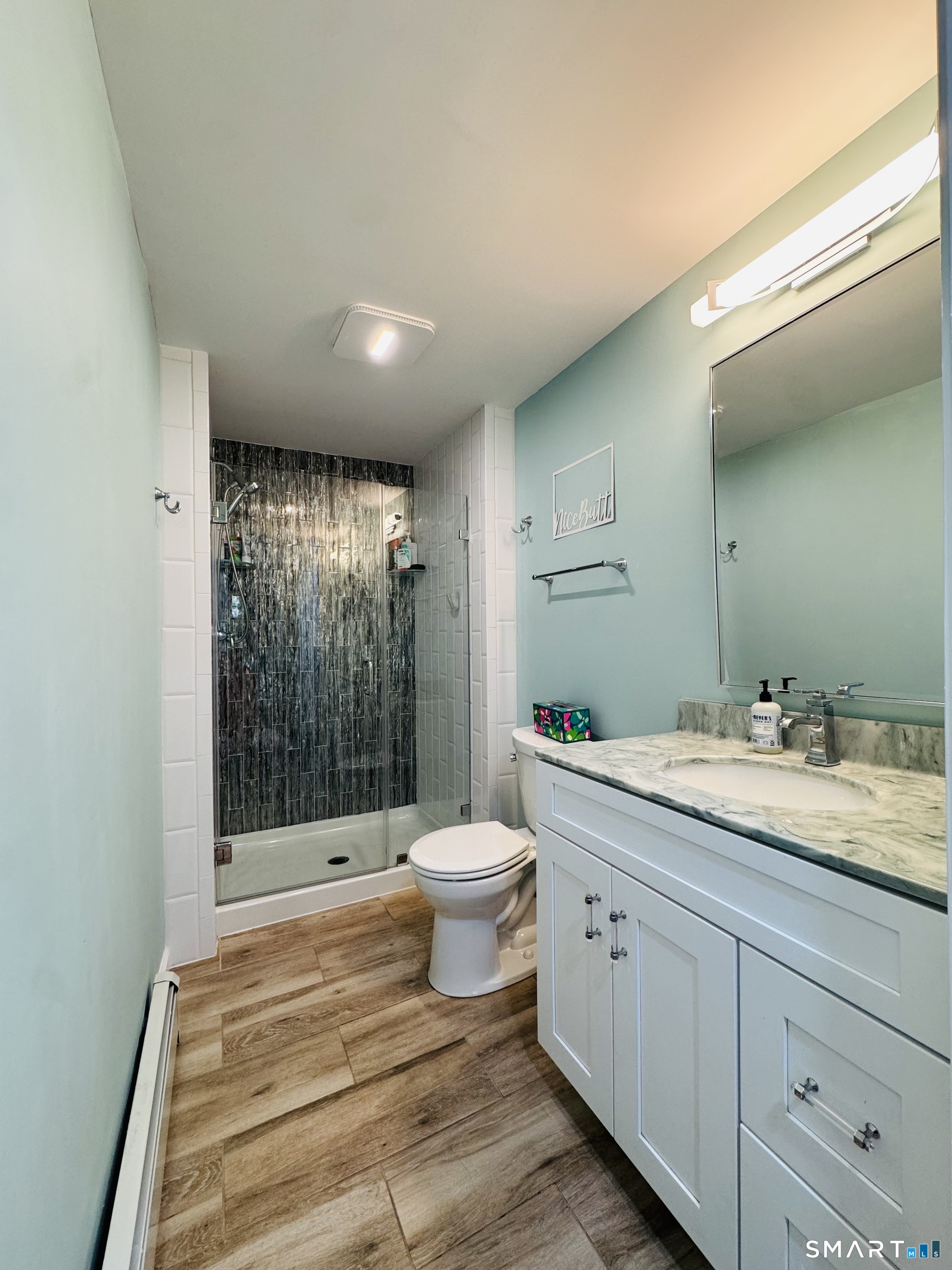 1514 Woodtick Road Wolcott, CT 06716 - Photo 12 of 23 a bathroom with a double vanity sink toilet and shower