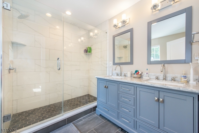 6 Elm Street, Unit 10 Madison, NJ 07940 - Photo 15 of 15 a bathroom with double vanity and a mirror