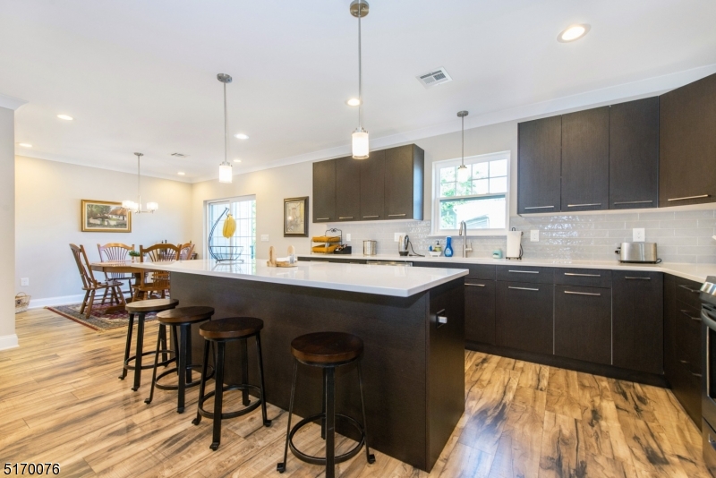 6 Elm Street, Unit 10 Madison, NJ 07940 - Photo 3 of 15 a kitchen with a sink cabinets and wooden floor