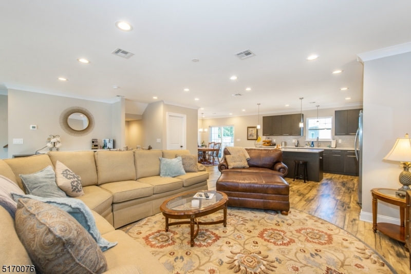 6 Elm Street, Unit 10 Madison, NJ 07940 - Photo 5 of 15 a living room with furniture and view of kitchen