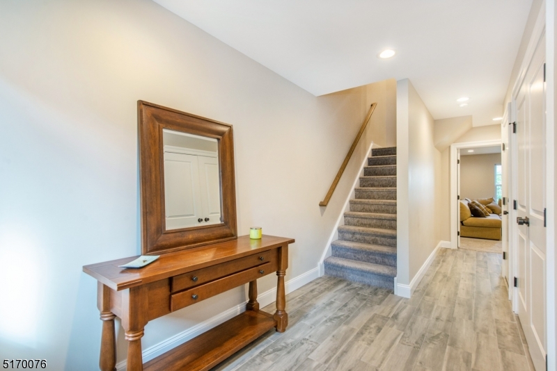 6 Elm Street, Unit 10 Madison, NJ 07940 - Photo 8 of 15 a view of entryway and hall with wooden floor