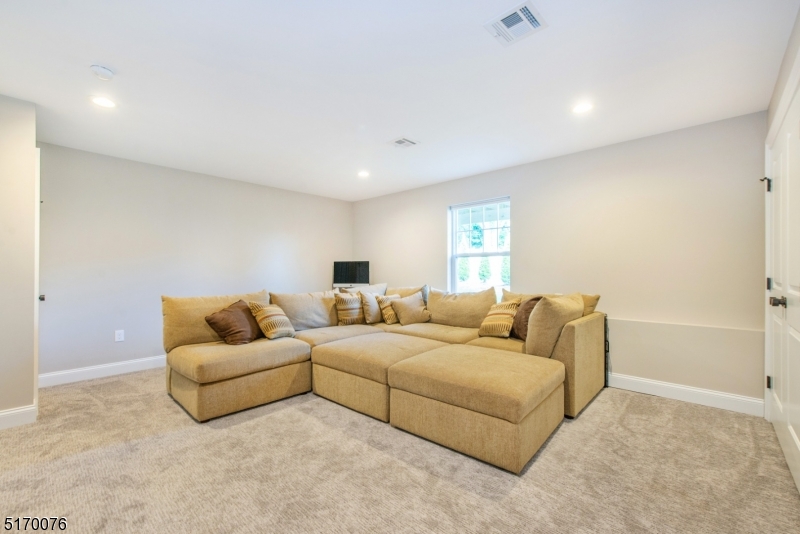6 Elm Street, Unit 10 Madison, NJ 07940 - Photo 10 of 15 a living room with furniture and a couch