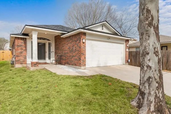 front view of a house with a yard
