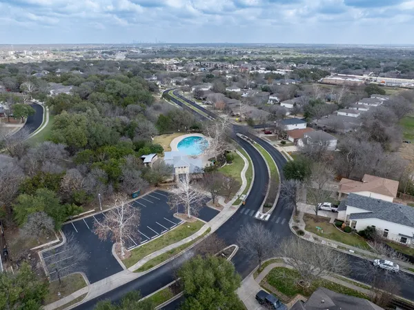 an aerial view of a house with a swimming pool