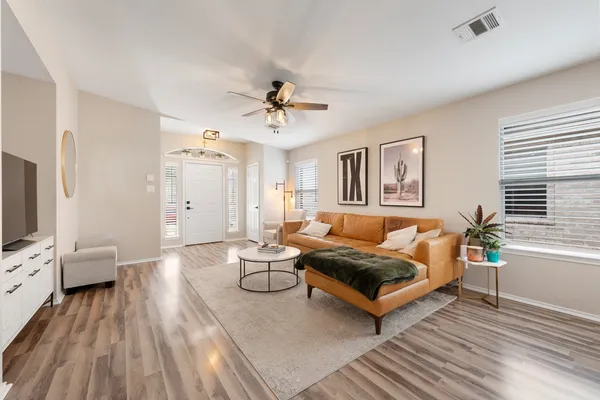 a living room with furniture and a flat screen tv