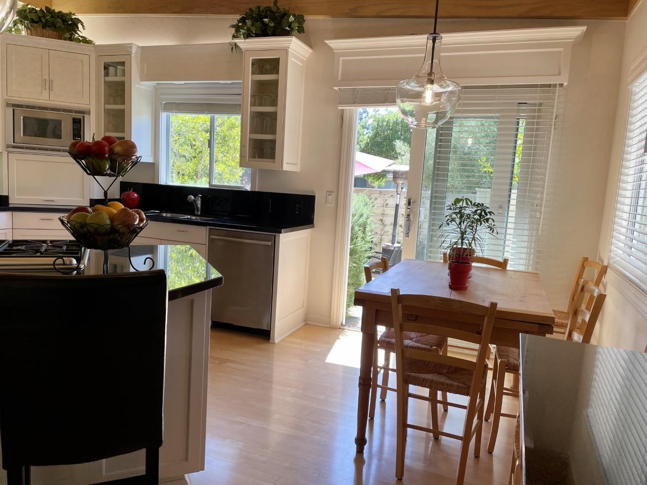 14 Oak Road Santa Cruz, CA 95060 - Photo 25 of 53 a kitchen with a stove a table and chairs in it