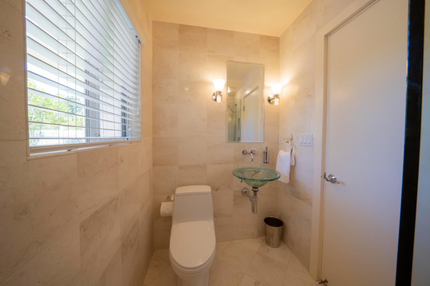 14 Oak Road Santa Cruz, CA 95060 - Photo 41 of 53 a white toilet sitting next to a bathroom sink and vanity