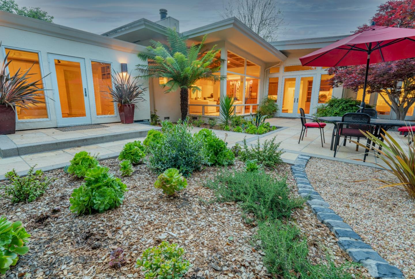 14 Oak Road Santa Cruz, CA 95060 - Photo 50 of 53 a view of a patio with a table and chairs under an umbrella