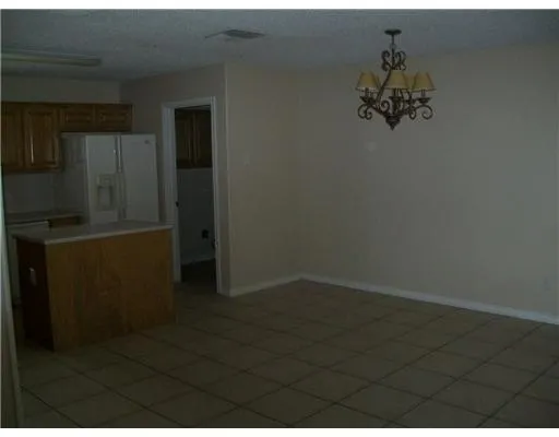 an empty room with wooden floor