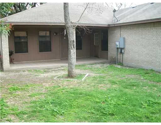 a house with yard in front of it