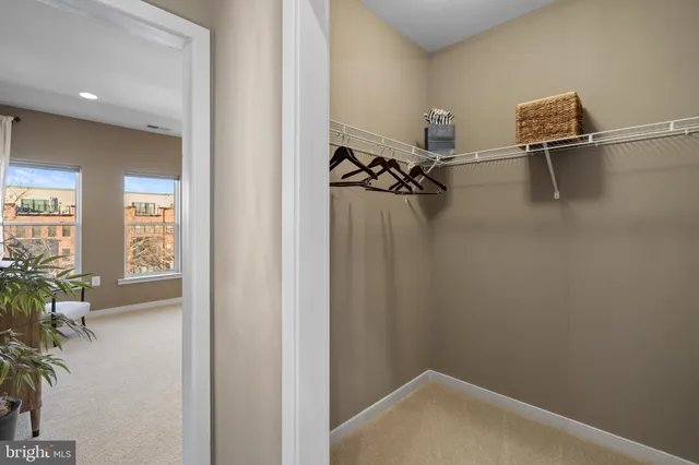 a bathroom with a double vanity sink toilet and shower