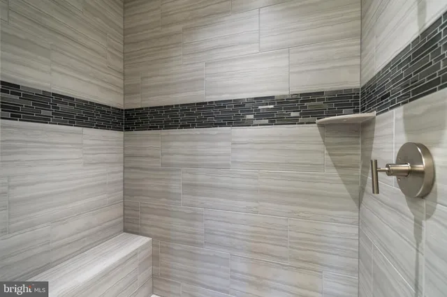 a kitchen with granite countertop a table and chairs in it