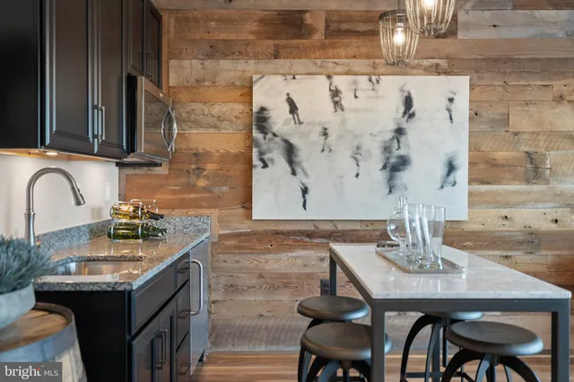 a picture of a bench in front of a wall