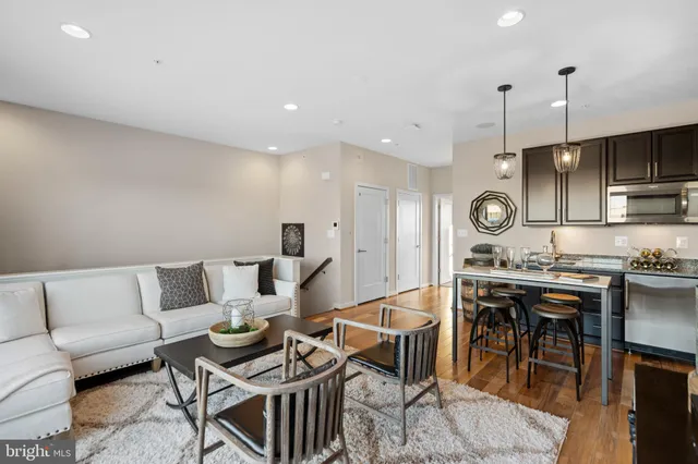 a view of a fountain in front of a house with a big yard