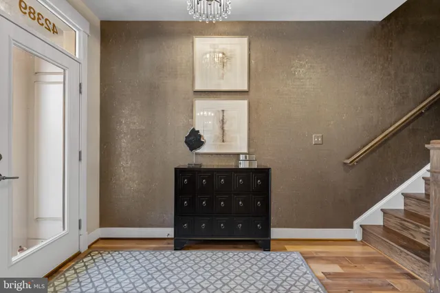 a bathroom with a sink mirror and toilet