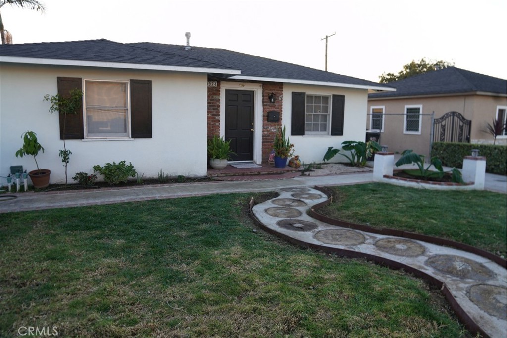 10924 Rincon Drive Whittier, CA 90606 - Photo 2 of 27 a front view of a house with a garden and plants