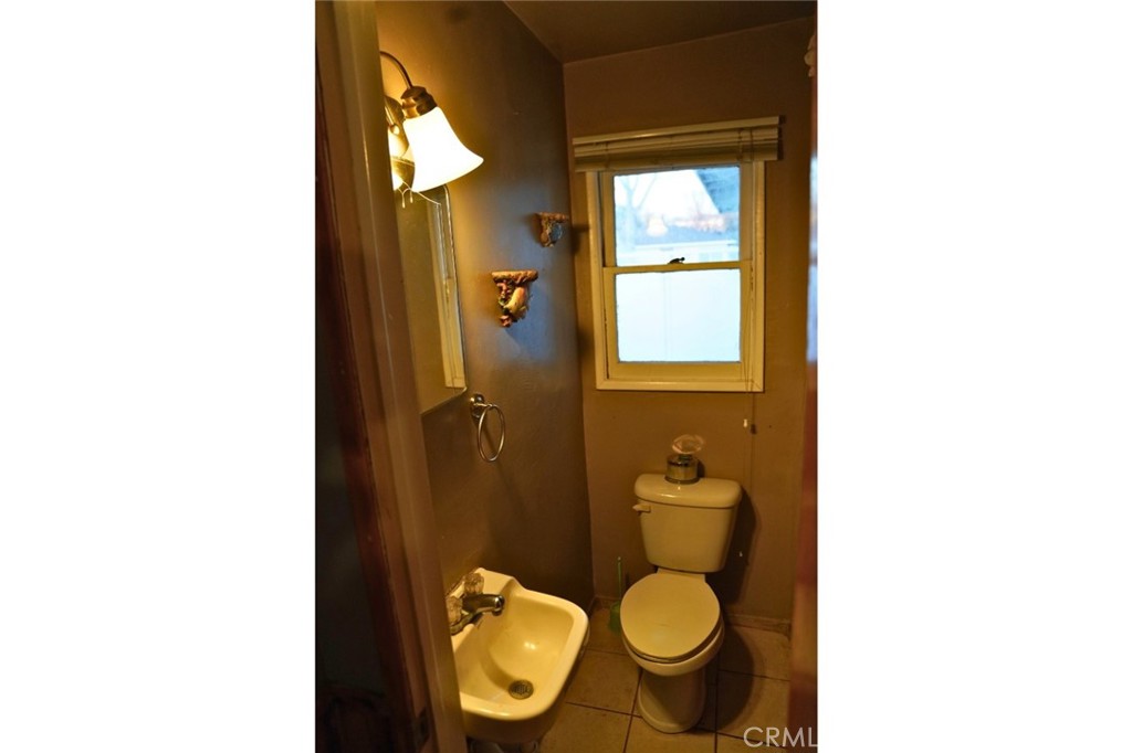 10924 Rincon Drive Whittier, CA 90606 - Photo 22 of 27 a bathroom with a toilet and a sink