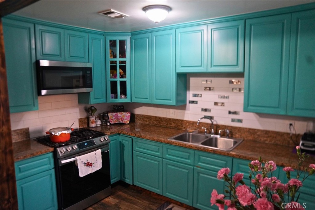 10924 Rincon Drive Whittier, CA 90606 - Photo 24 of 27 a kitchen with sink and cabinets