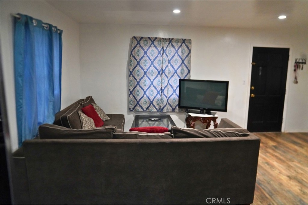 10924 Rincon Drive Whittier, CA 90606 - Photo 26 of 27 a room with furniture and flat screen tv