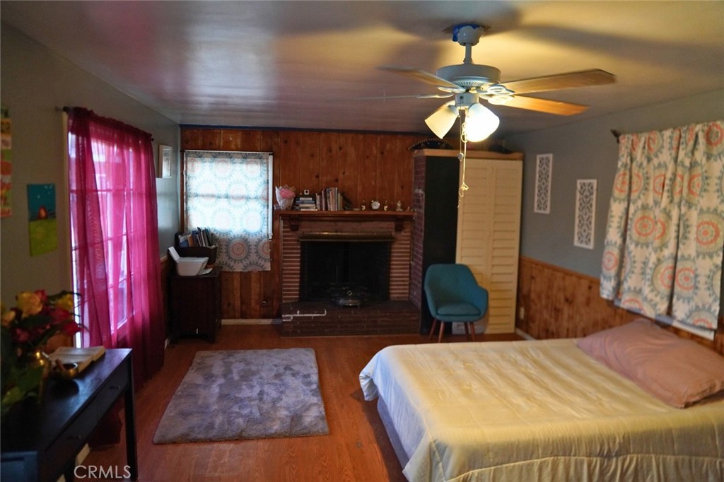 10924 Rincon Drive Whittier, CA 90606 - Photo 27 of 27 a bedroom with bed and a fireplace