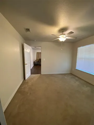 a view of an empty room with a fireplace