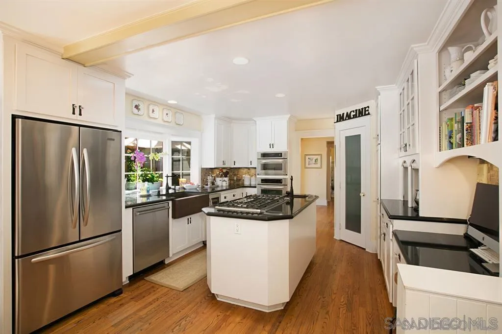 16348 Orchard Bend Road Poway, CA 92064 - Photo 3 of 23 a kitchen with stainless steel appliances granite countertop a refrigerator a stove a sink and a refrigerator