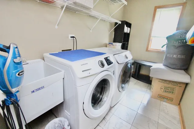 a utility room with dryer and washer