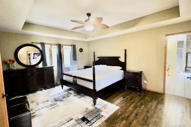 a bedroom with a bed and a mirror