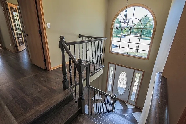 6 Allegheny Court Bolingbrook, IL 60440 - Photo 21 of 38 a view of an entryway with wooden floor and door
