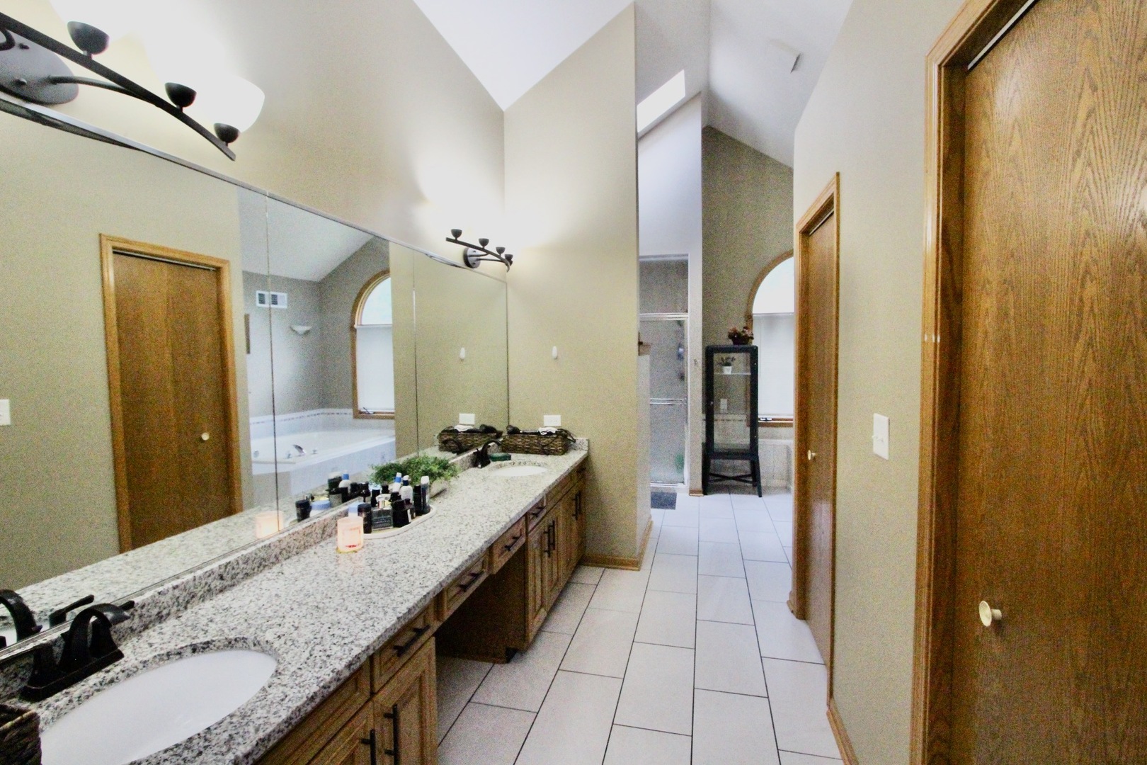 6 Allegheny Court Bolingbrook, IL 60440 - Photo 24 of 38 a bathroom with sink granite and a mirror