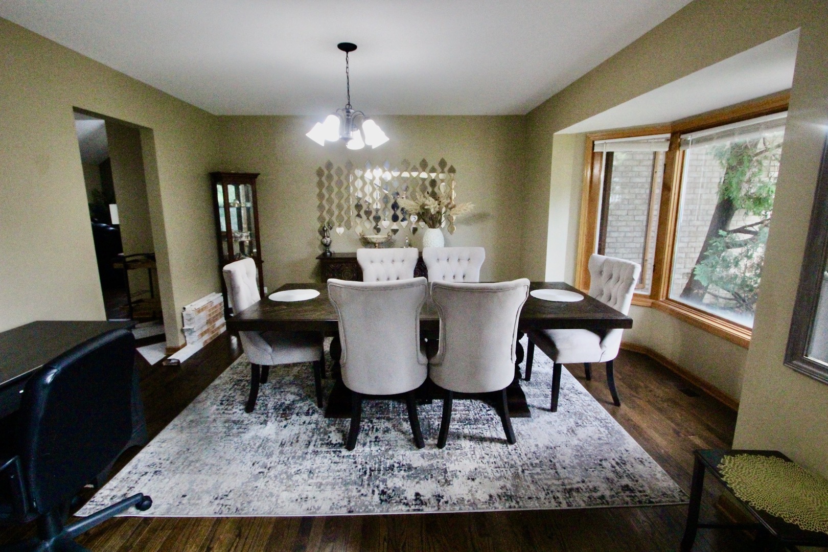 6 Allegheny Court Bolingbrook, IL 60440 - Photo 3 of 38 a dining room with furniture a chandelier and wooden floor