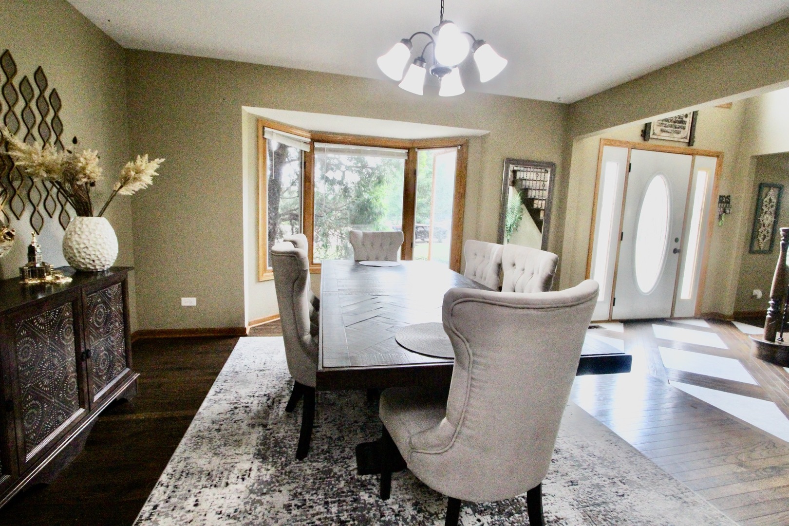 6 Allegheny Court Bolingbrook, IL 60440 - Photo 9 of 38 a living room with furniture and a chandelier
