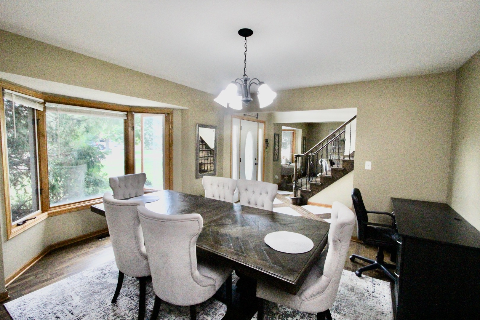 6 Allegheny Court Bolingbrook, IL 60440 - Photo 10 of 38 a dining room with furniture a chandelier and window